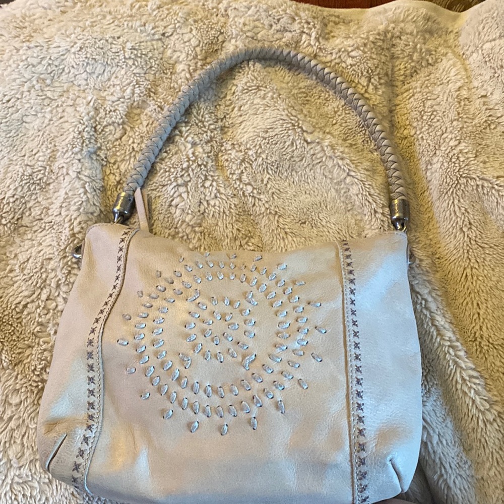 The Sak putty color bag in good used shape